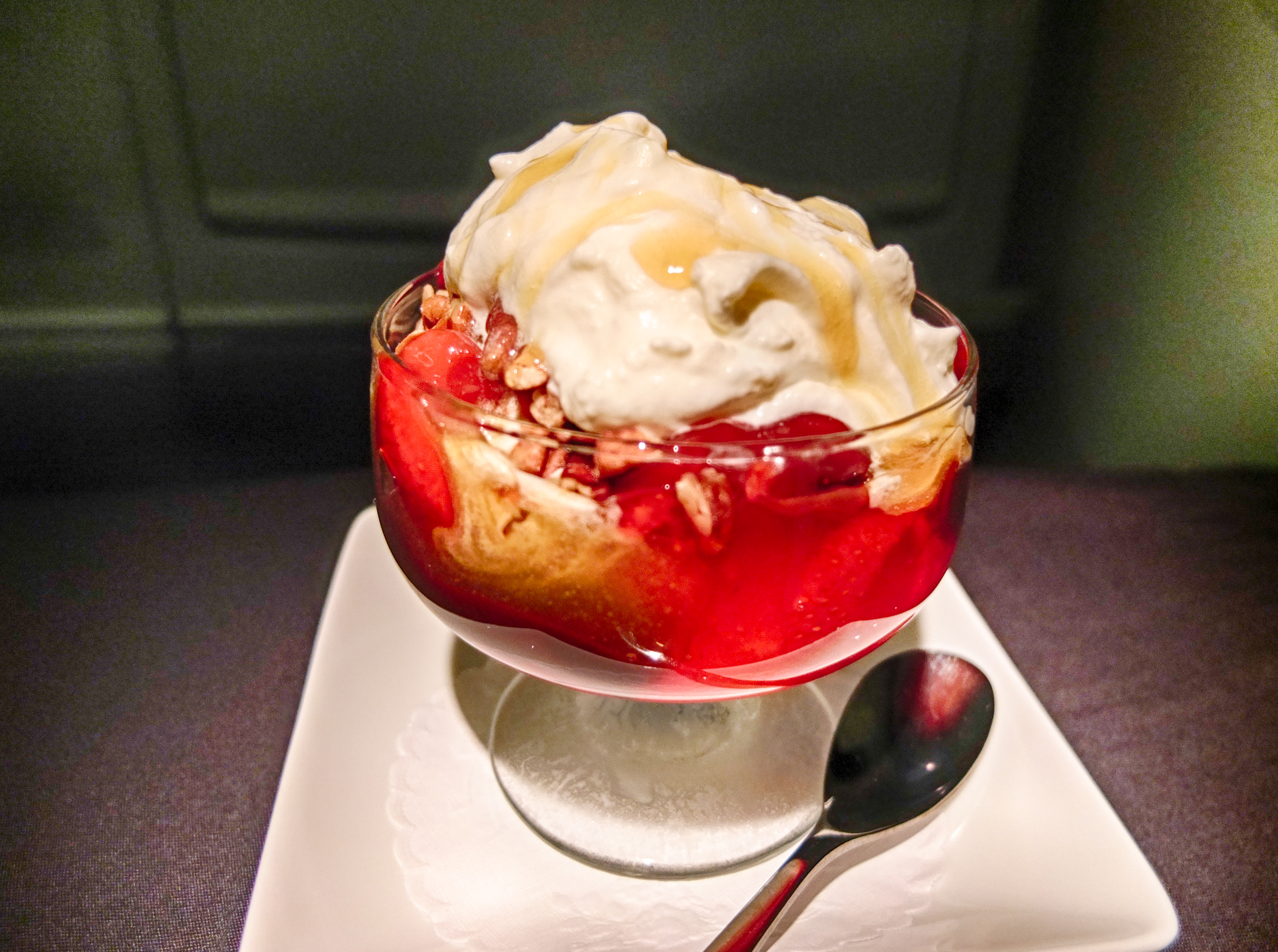 a dessert in a glass with a spoon
