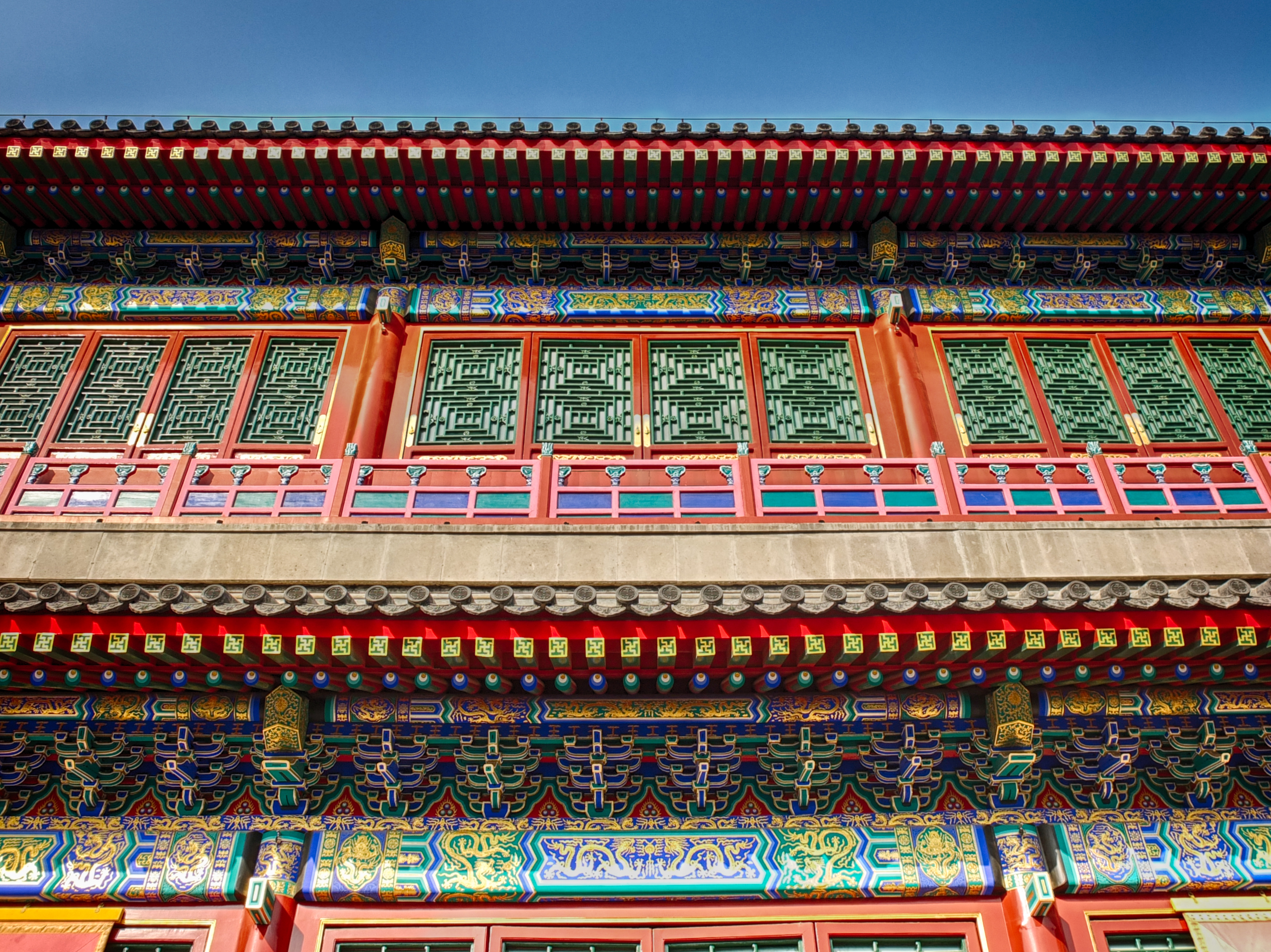 a colorful building with a red and blue wall