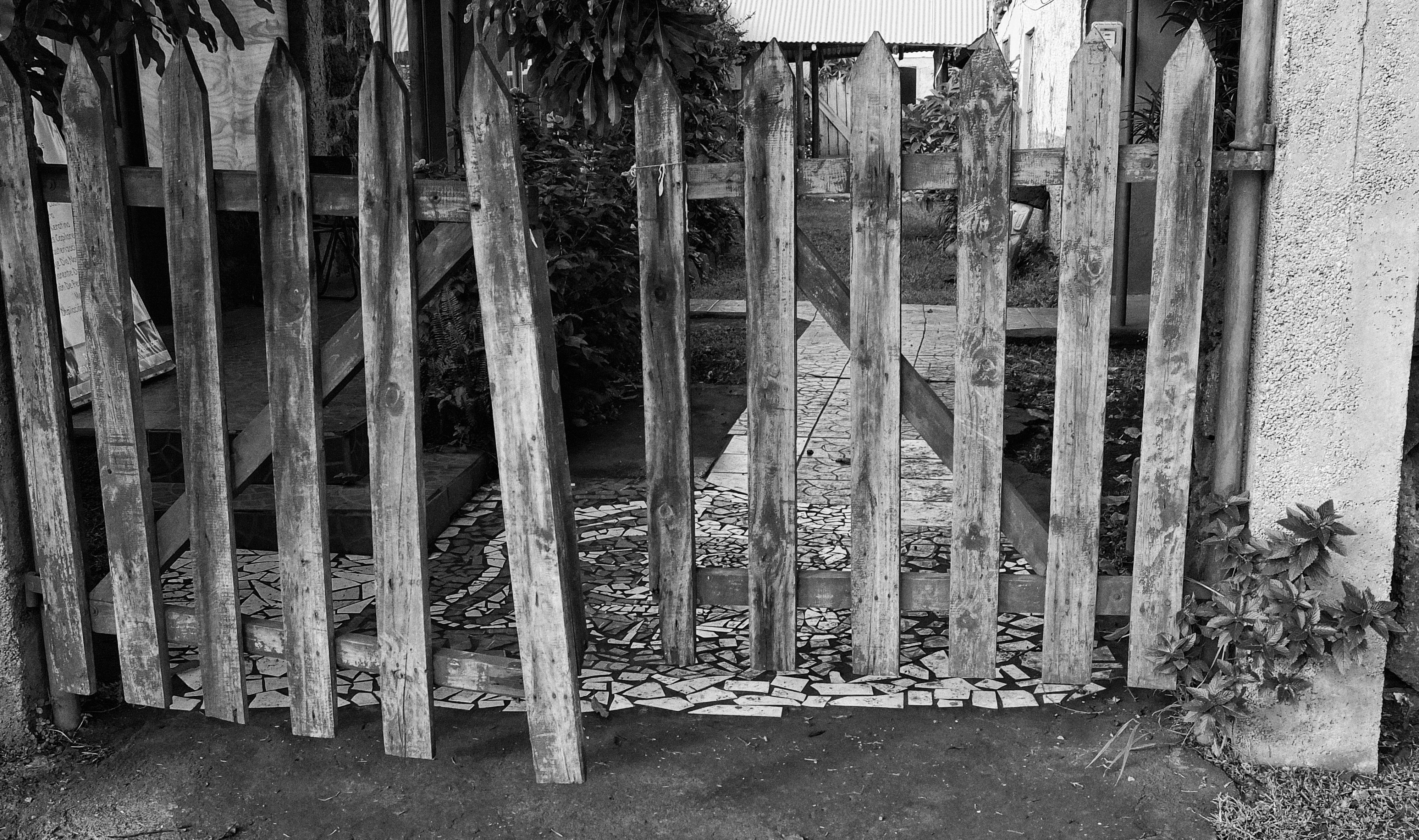 a wooden gate with a path