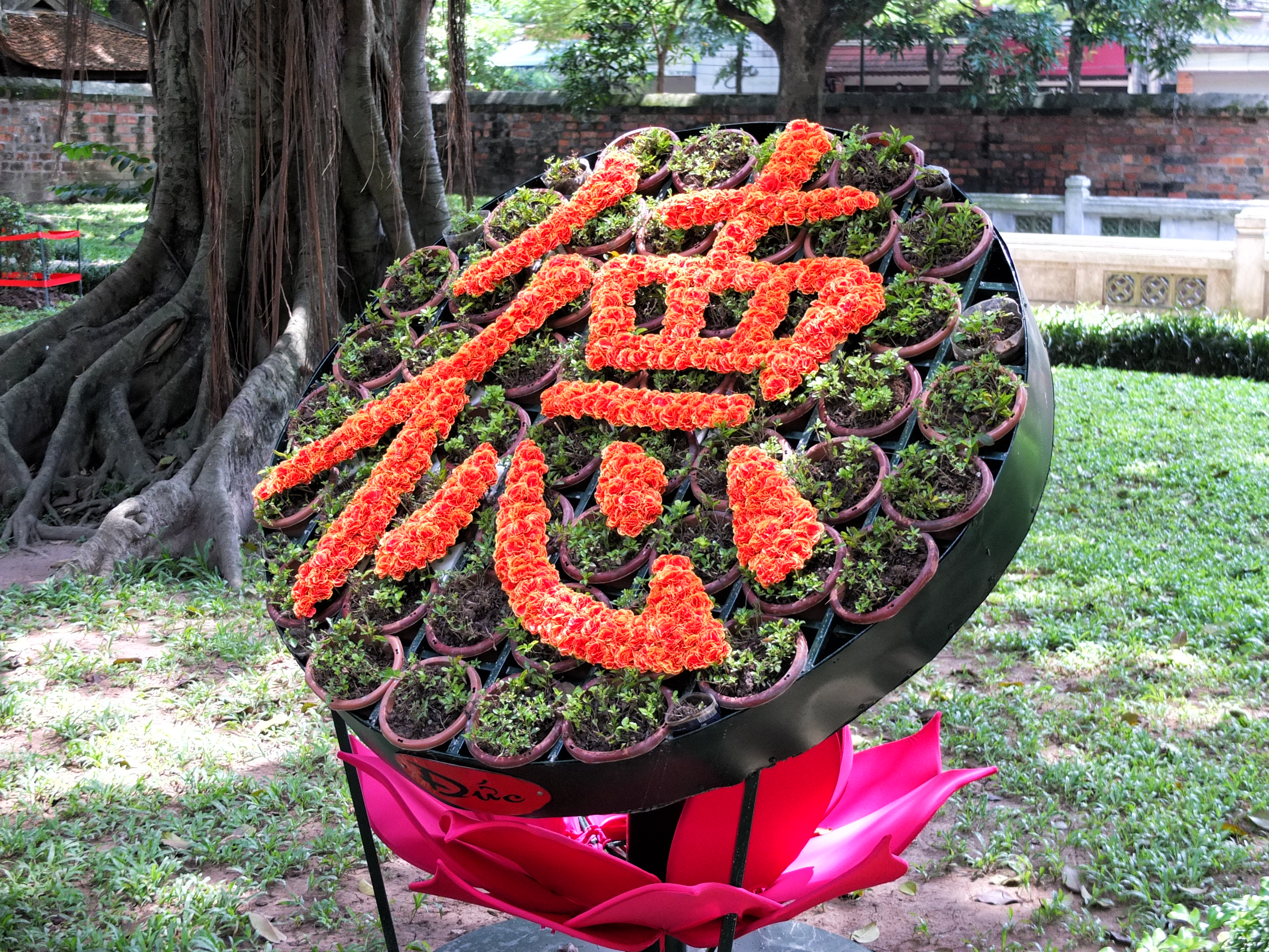 a flower arrangement with writing on it