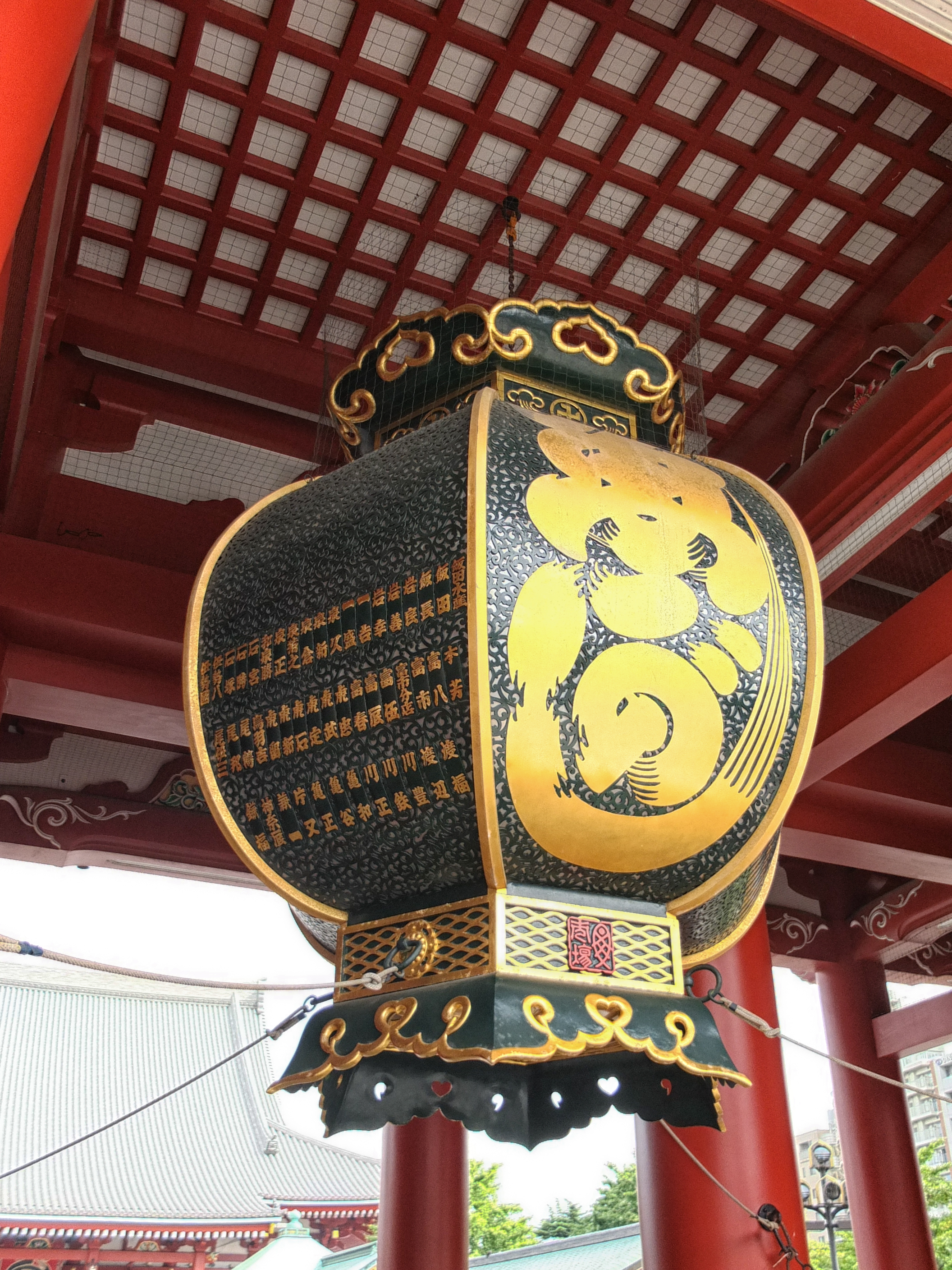 a large lantern with a gold design