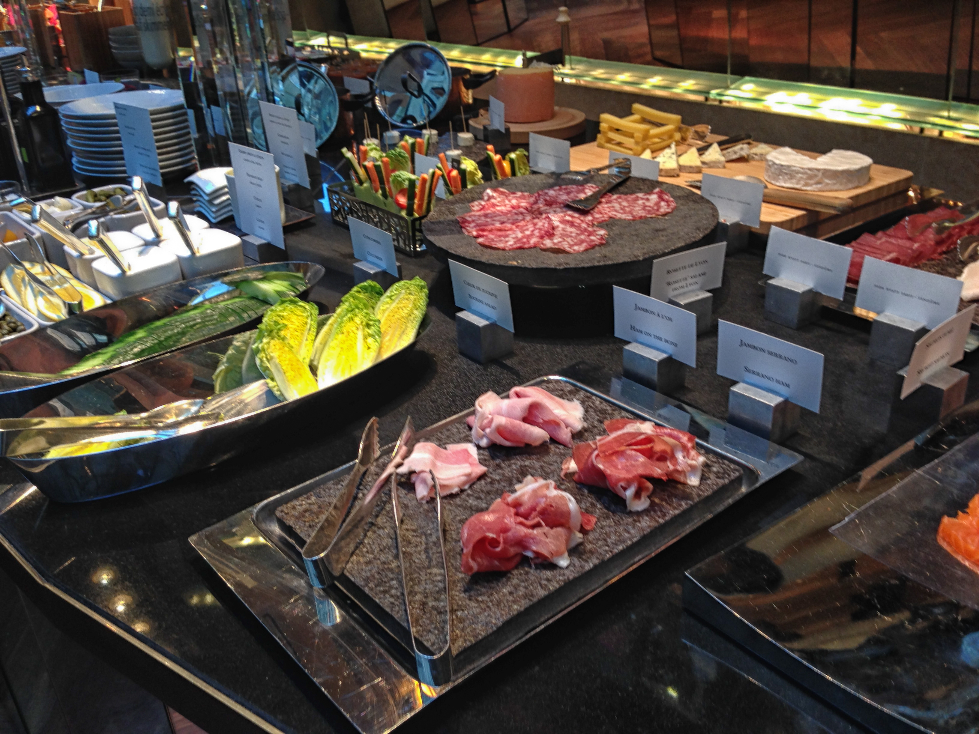 a buffet table with different types of meats