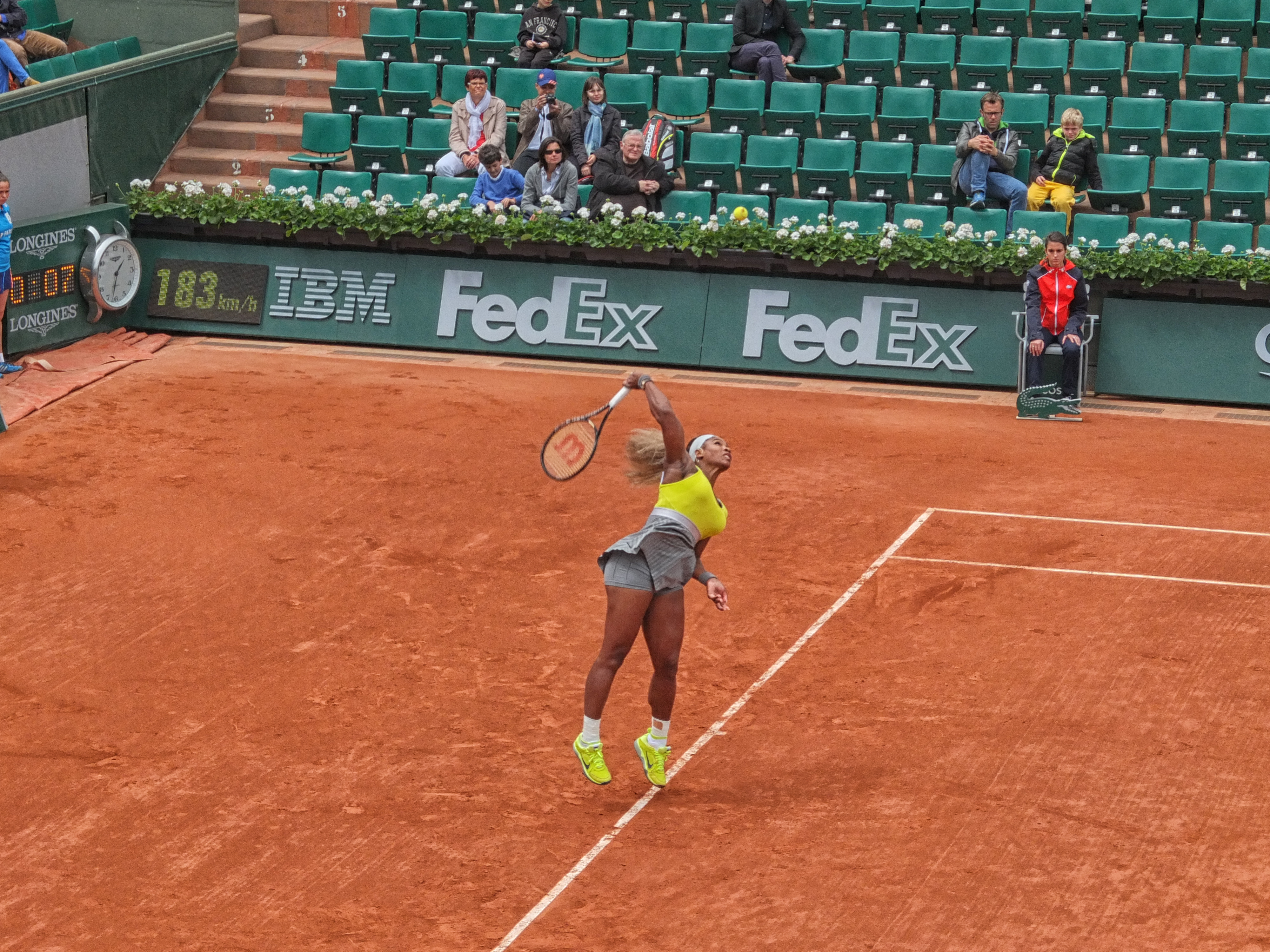 Serena mid-serve