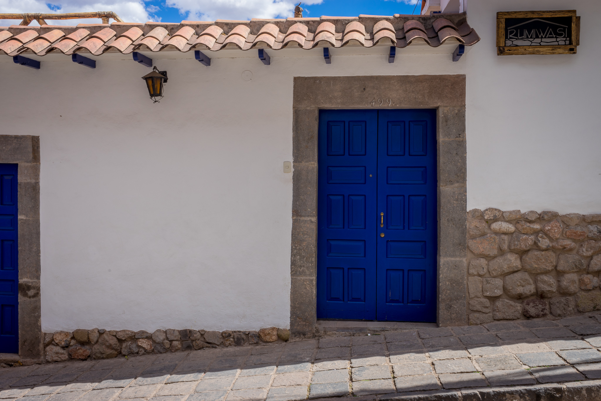 a blue door on a white building