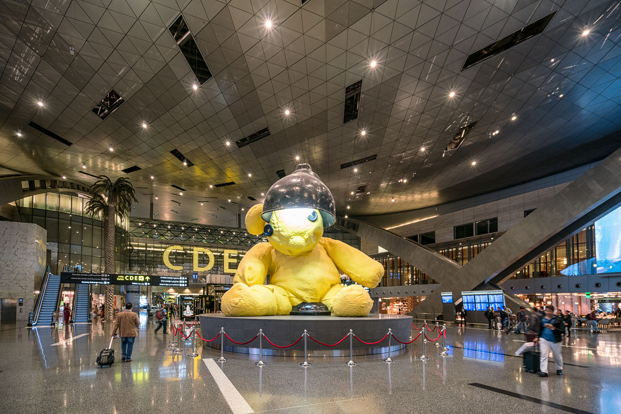 a large stuffed bear statue in a large building