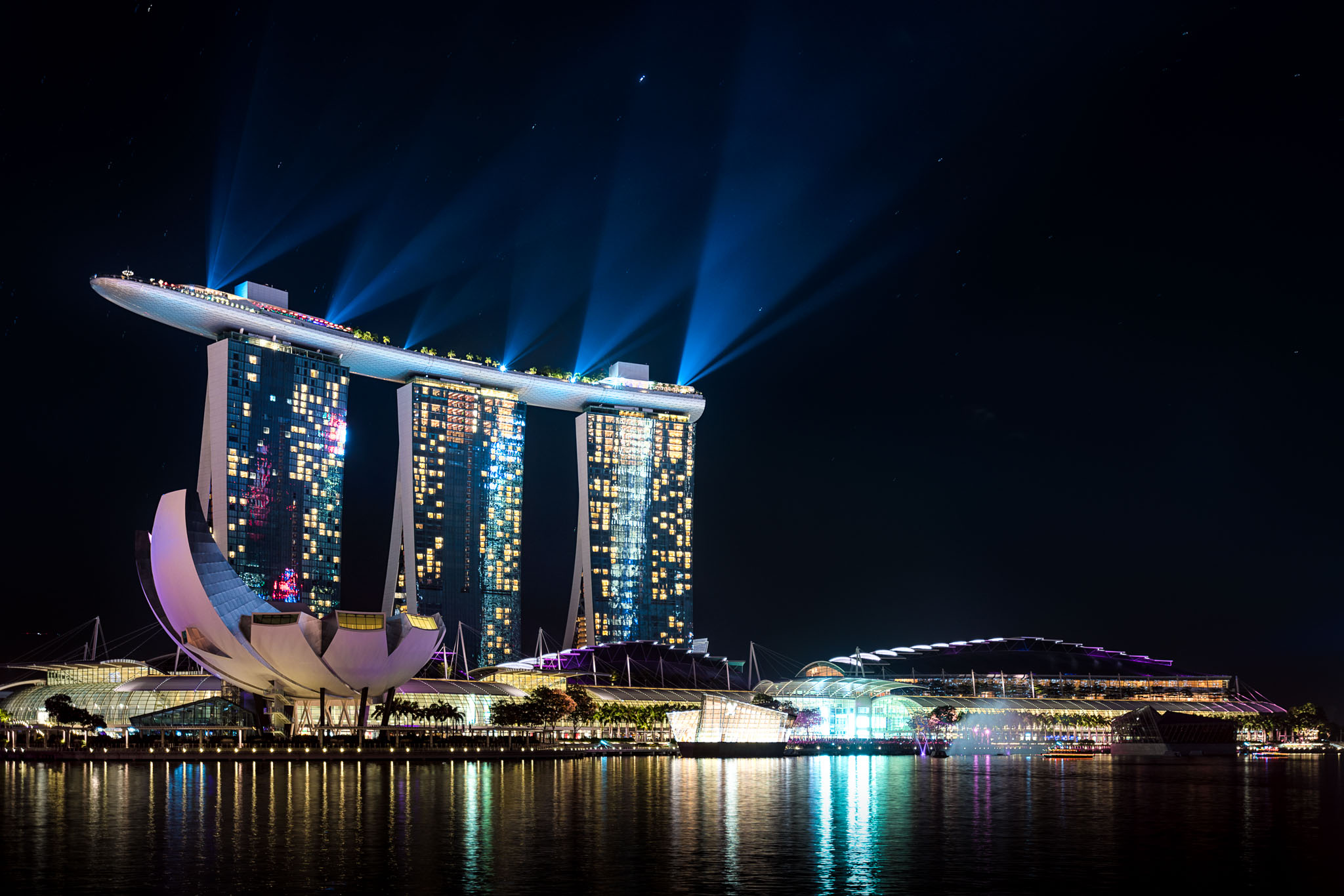 Marina Bay Sands skyline with lights and a body of water