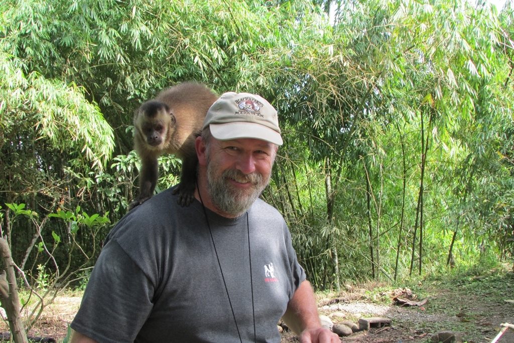 a man with a monkey on his shoulder