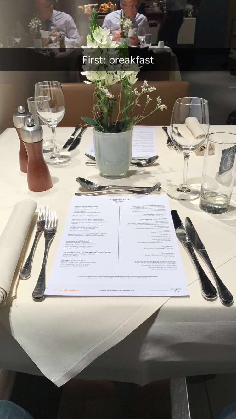 a table with a menu and silverware
