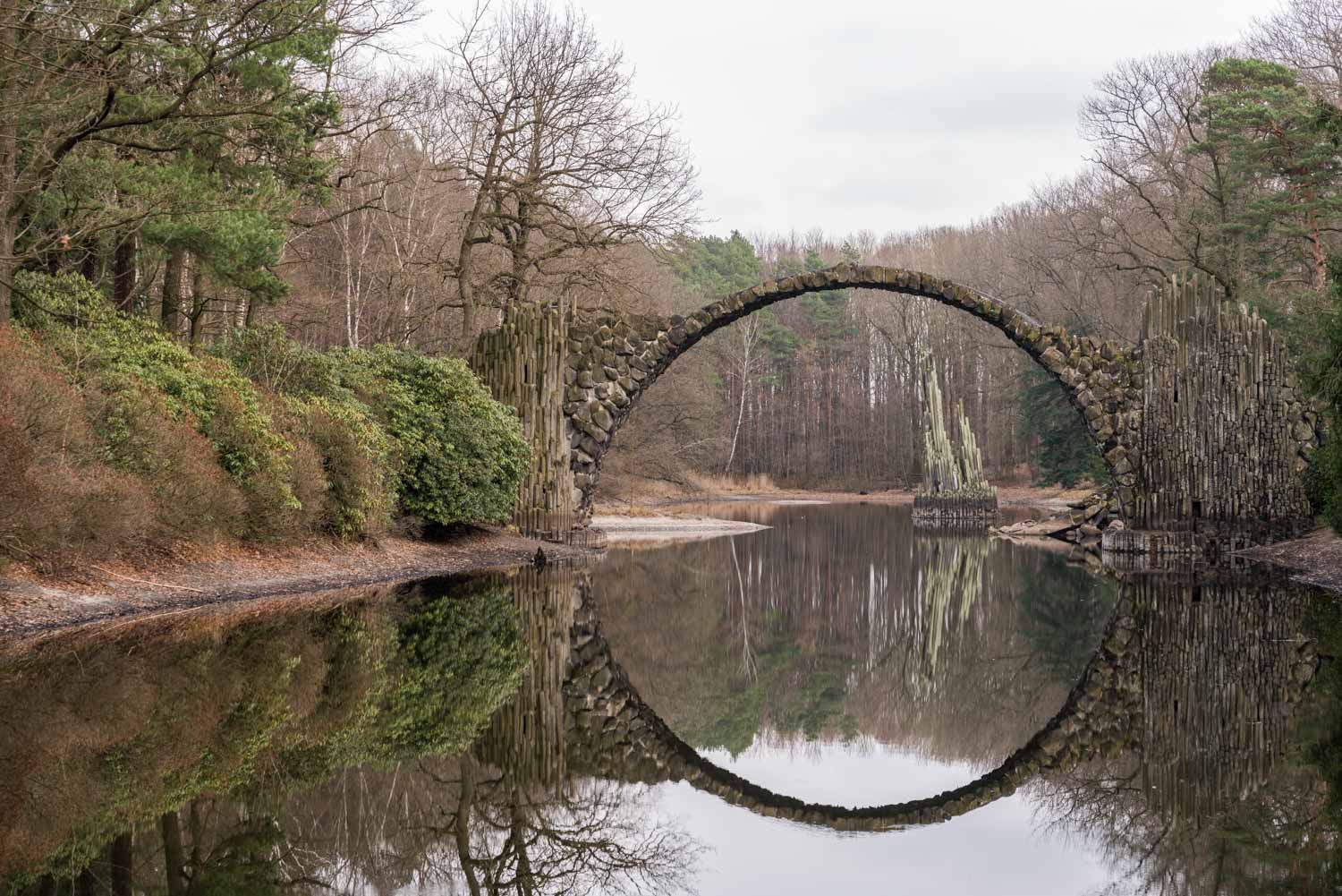 a stone bridge over water