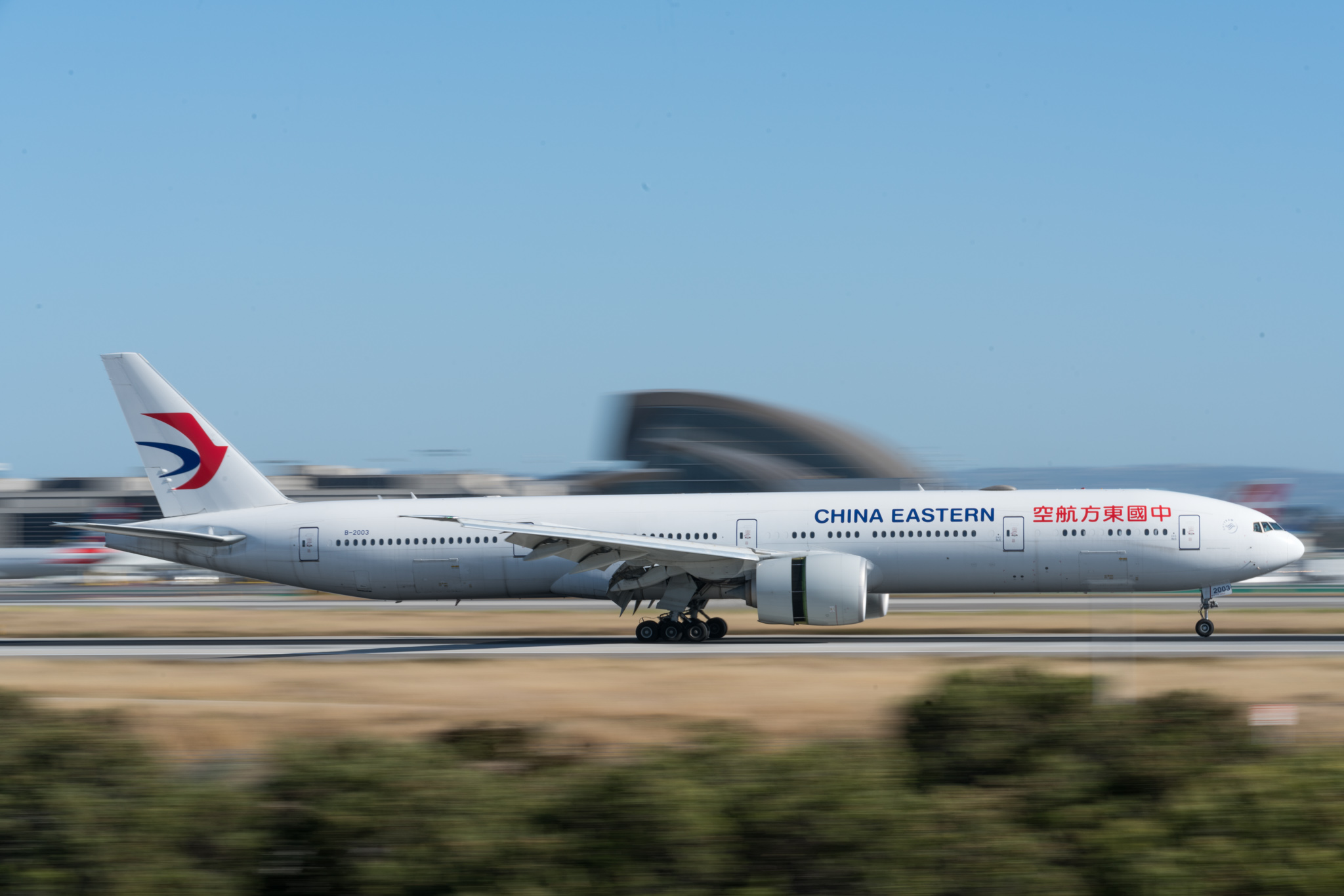 a white airplane on a runway