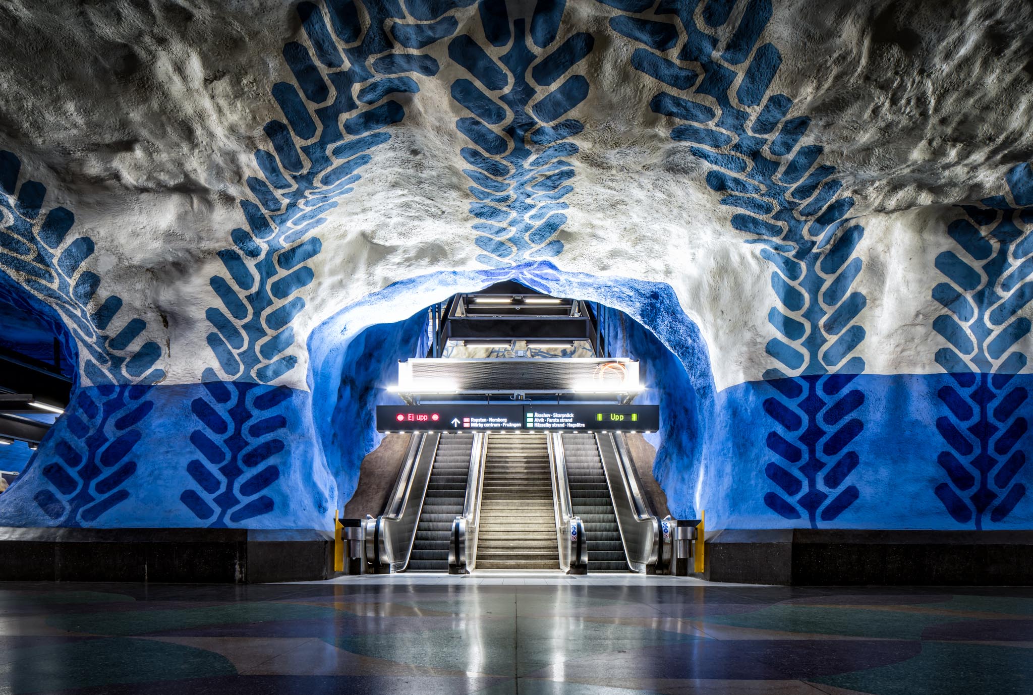 a blue and white painted tunnel