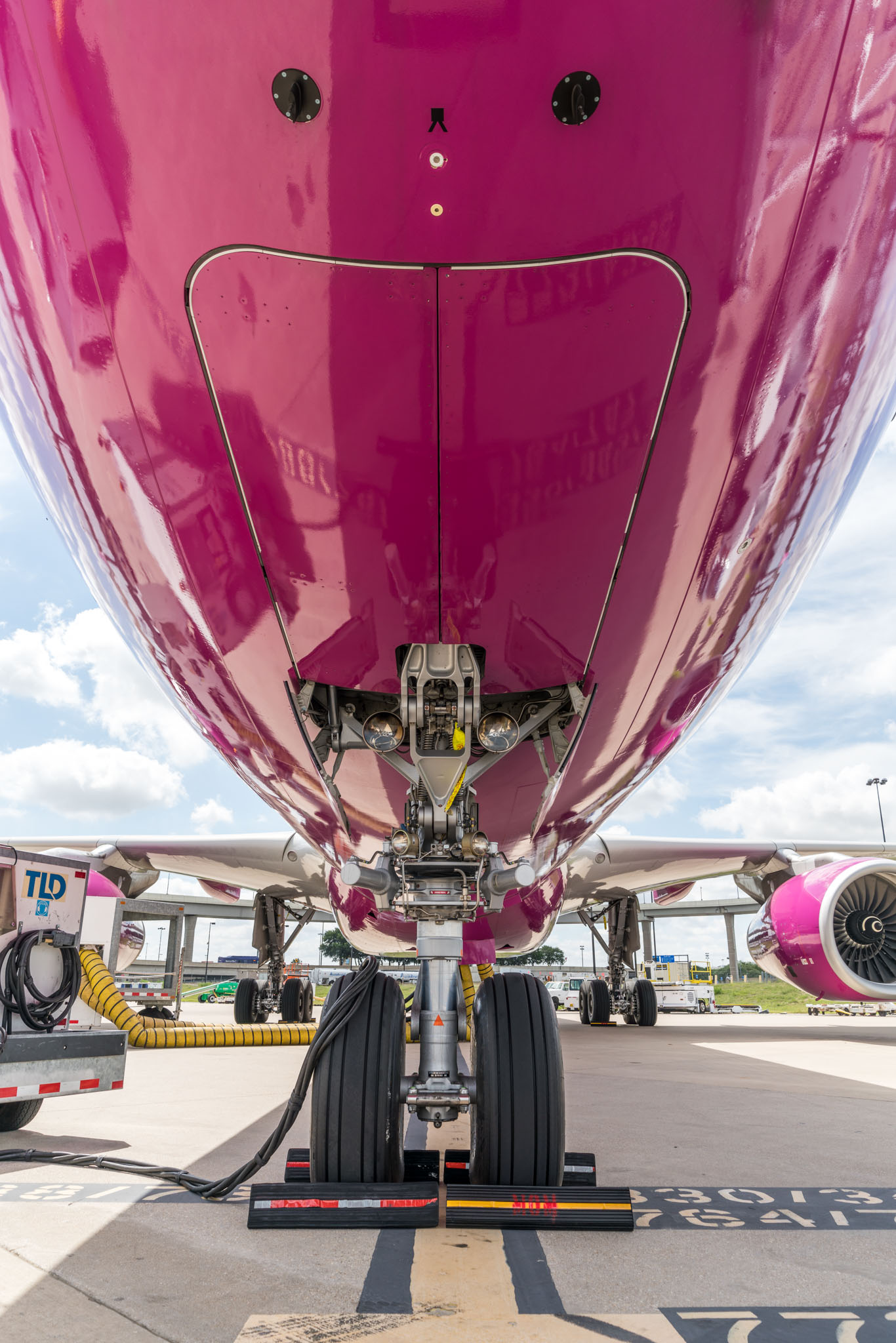 the front of a pink airplane