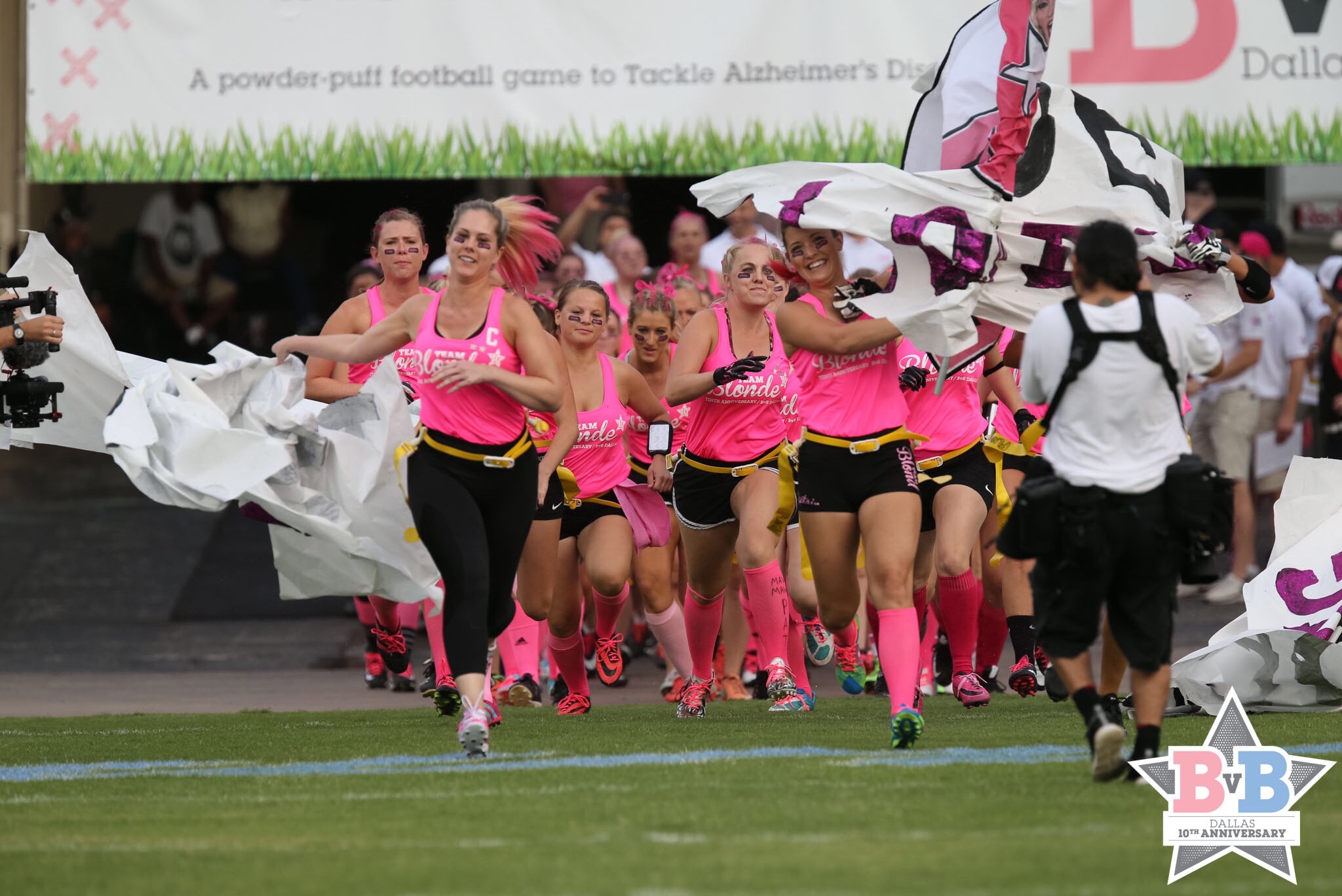 a group of women running on a field