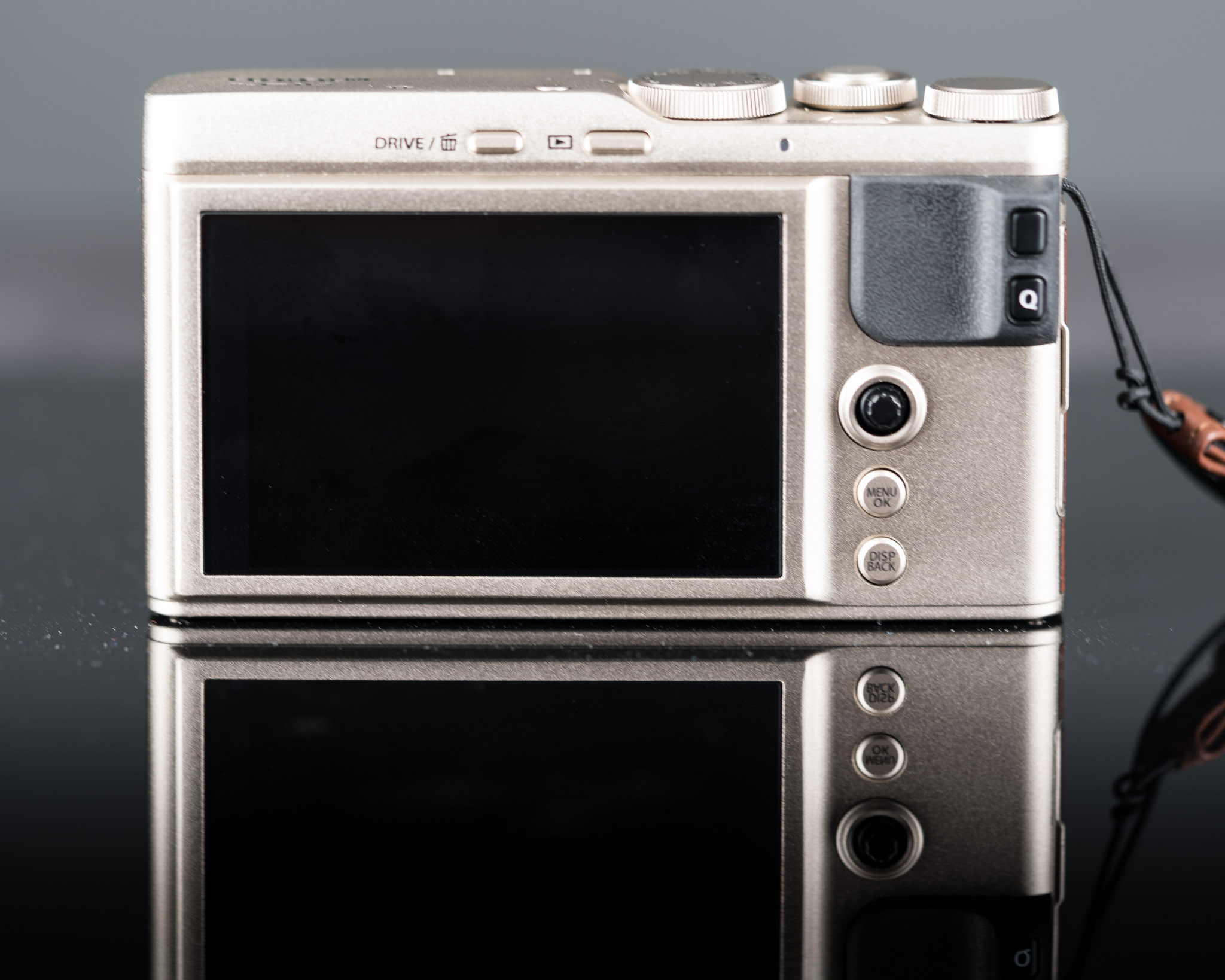 a silver camera with a black screen