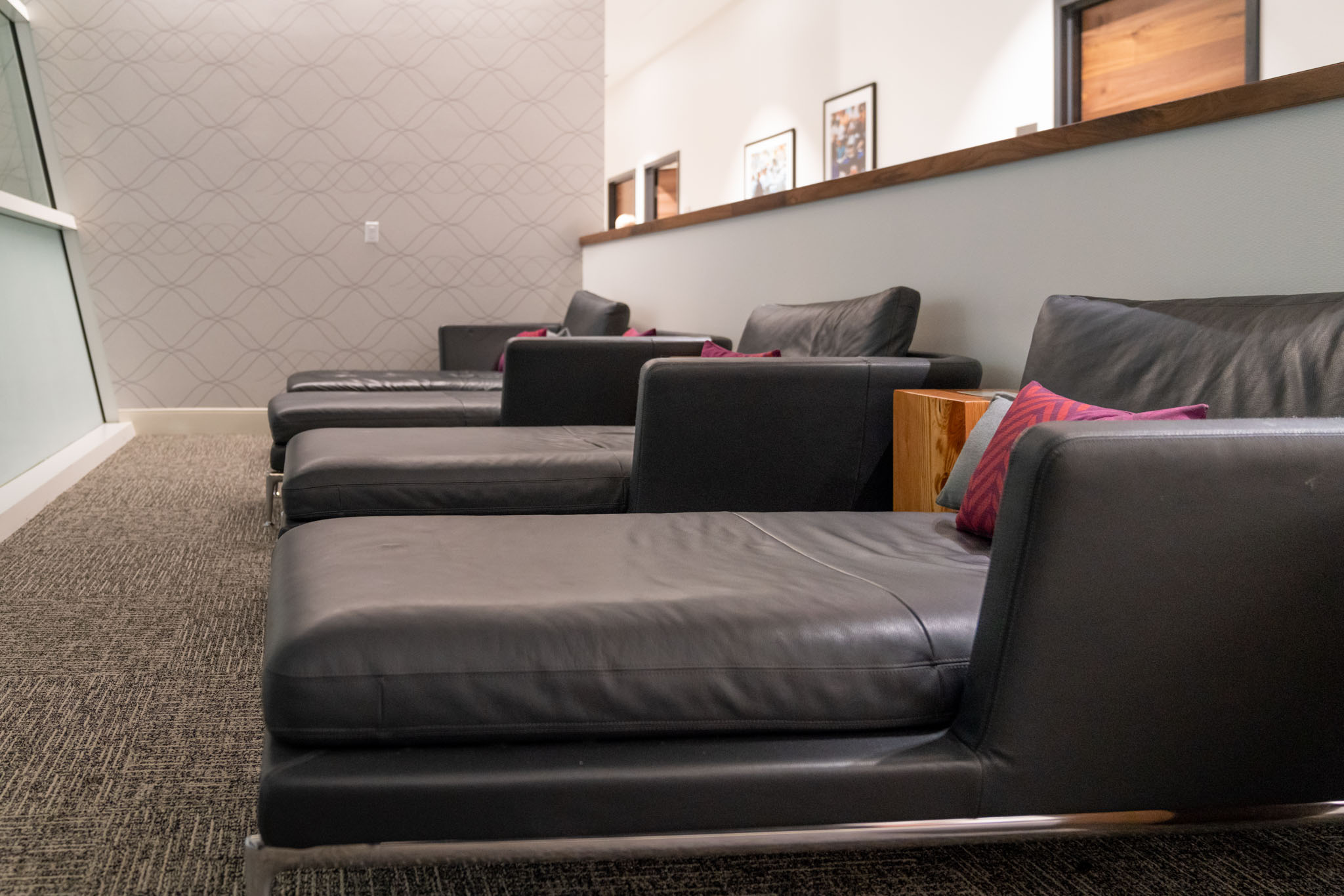 a group of black leather chairs in a room