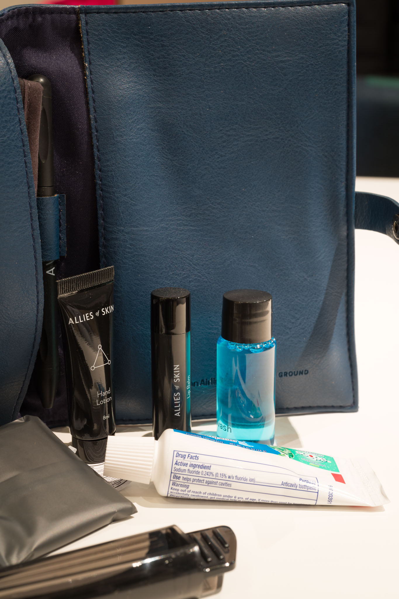 a bag with a few small bottles of toiletries