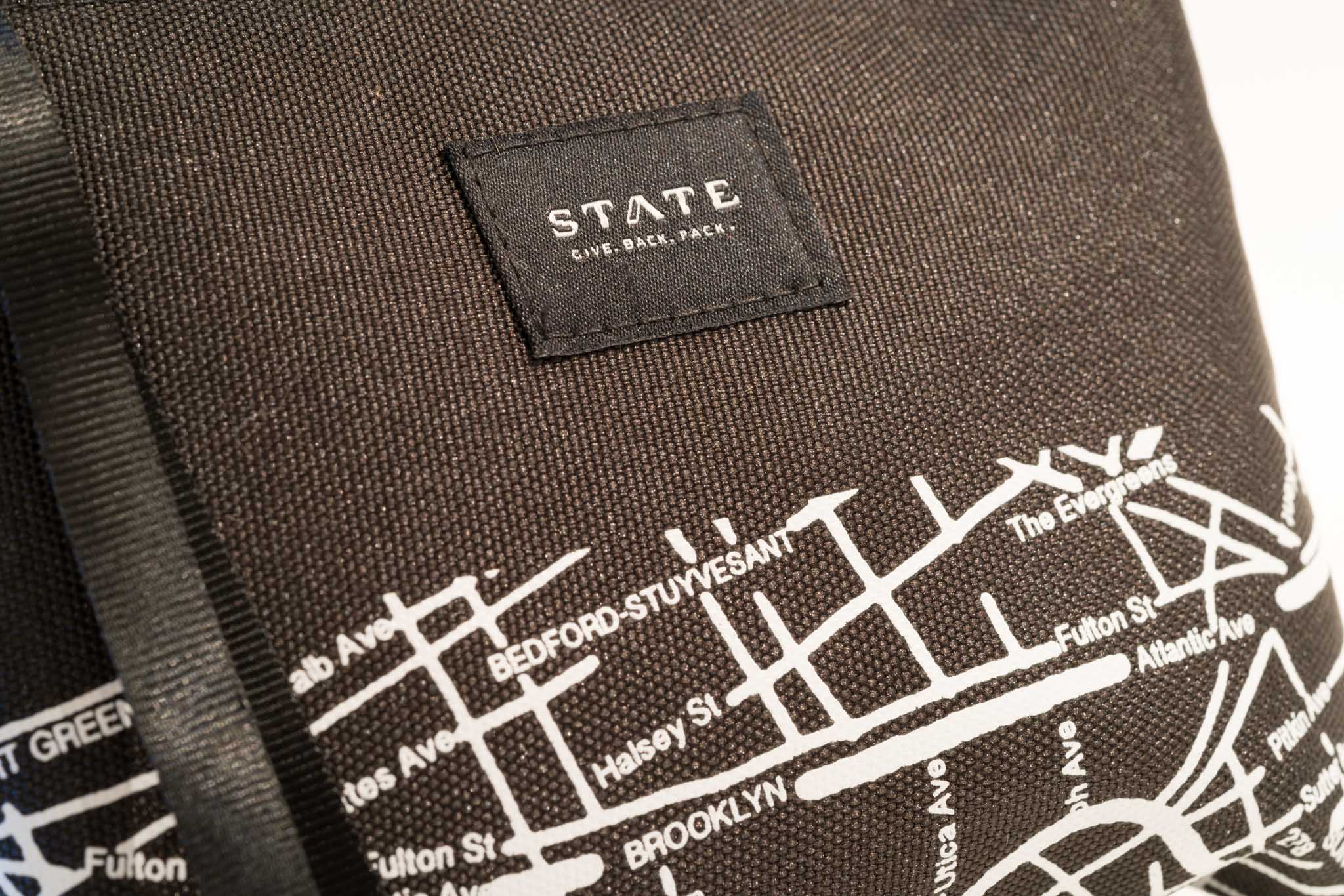 a black and white label on a brown fabric