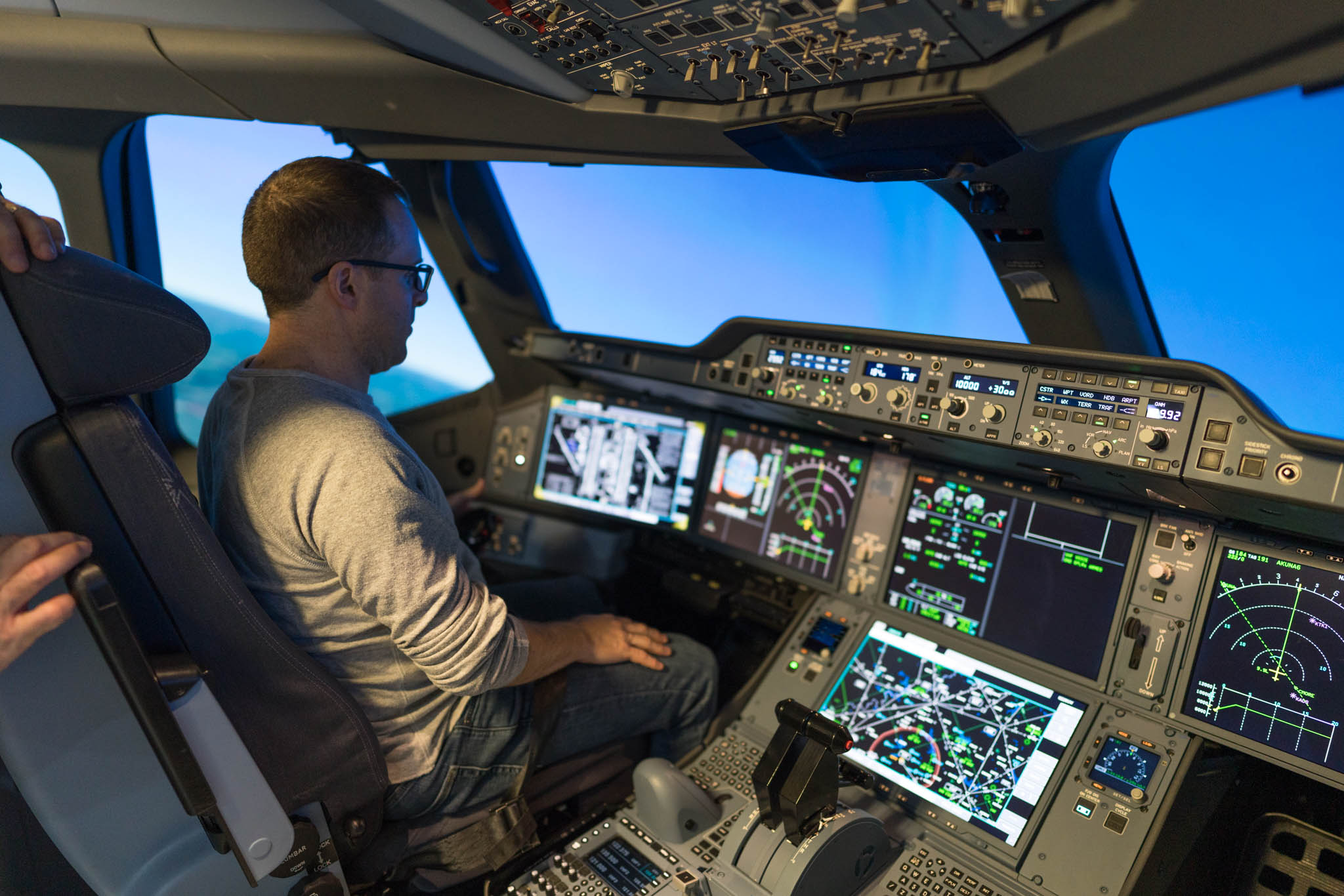 a man in a cockpit of an airplane