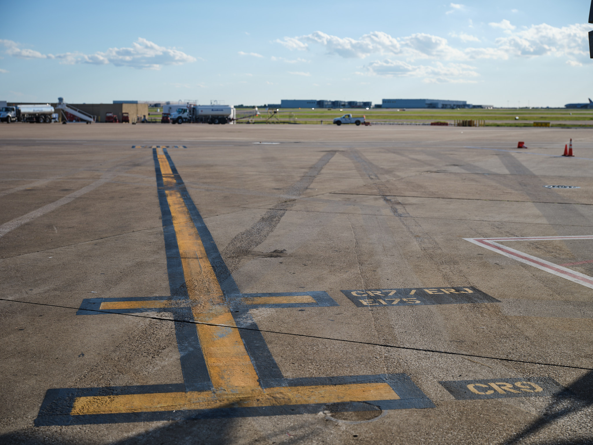 a runway with yellow lines painted on it