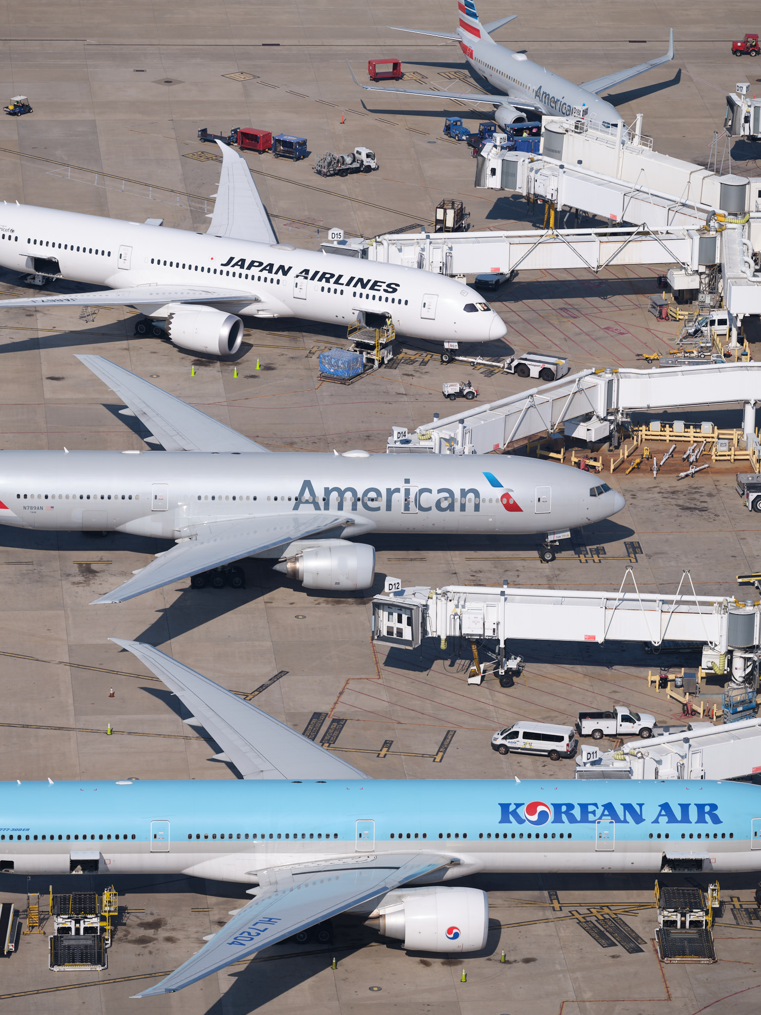 an aerial view of airplanes at an airport