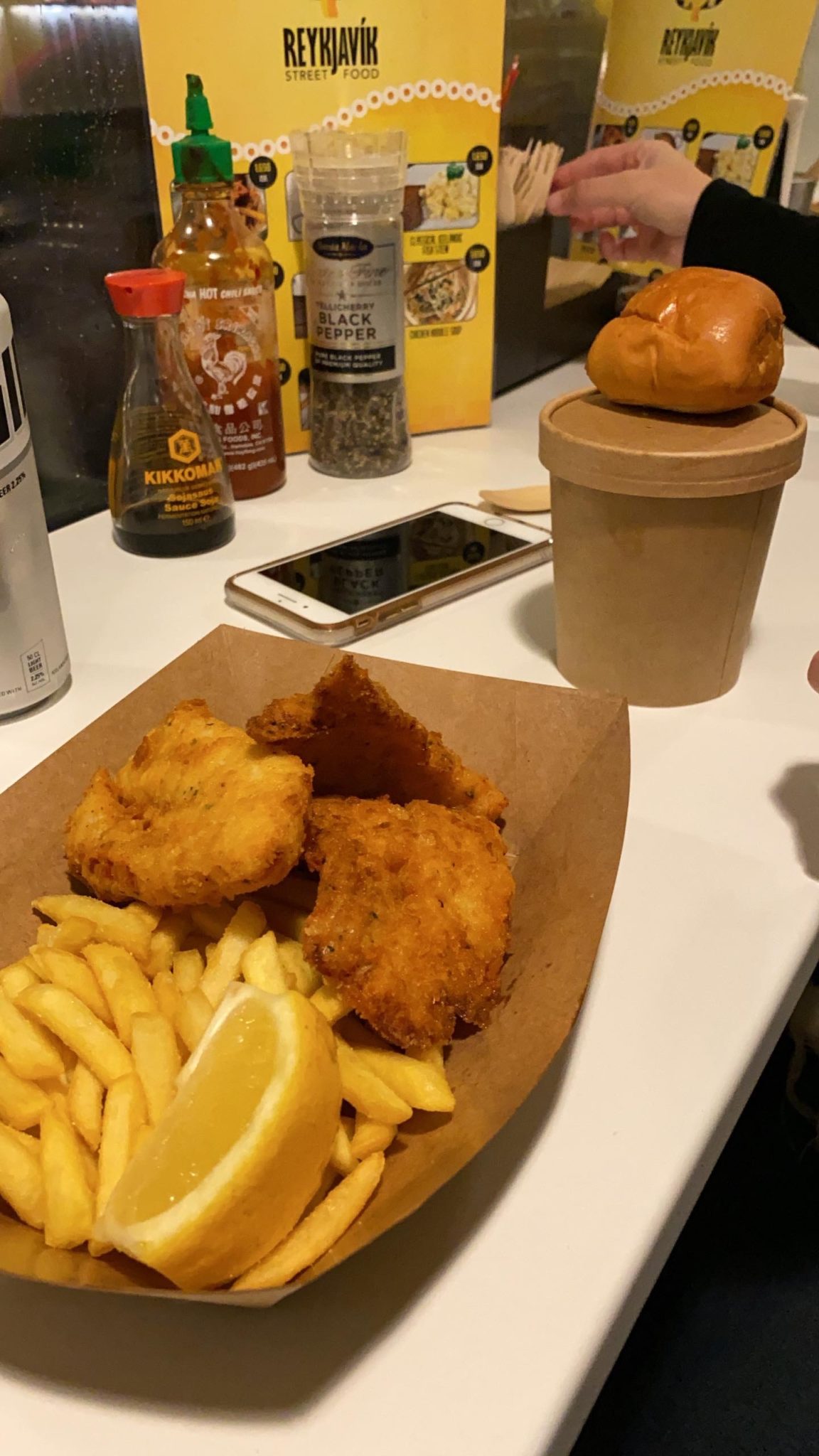 a plate of fried fish and fries on a table