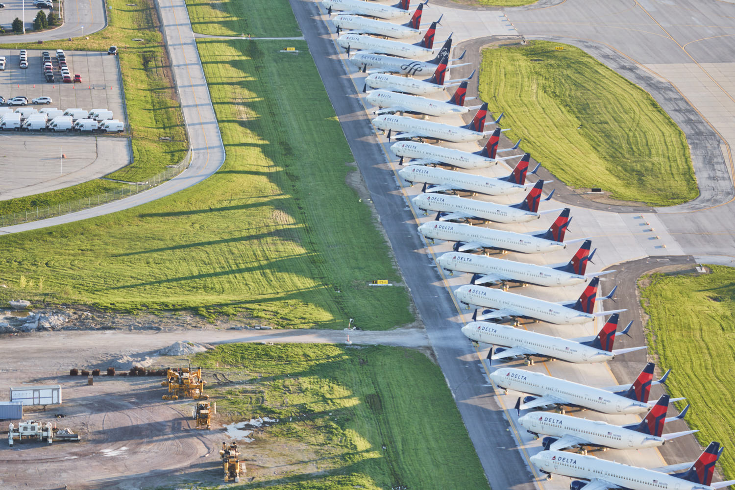 an aerial view of airplanes parked on a runway