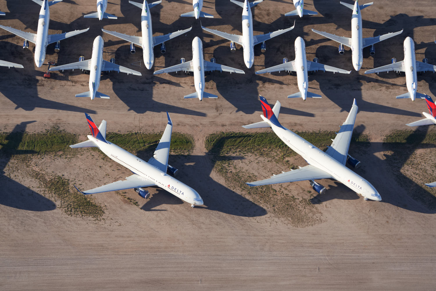 a group of airplanes parked on the ground