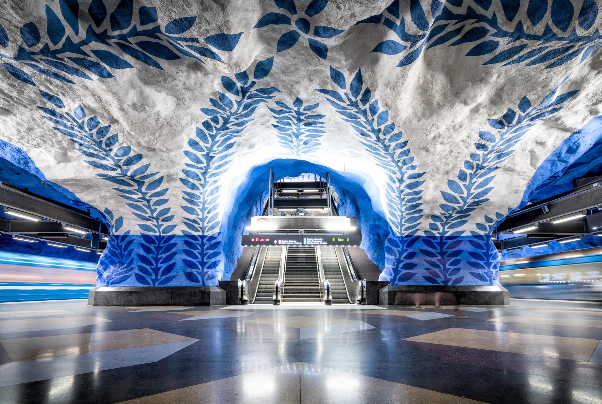 a blue and white painted ceiling in a subway